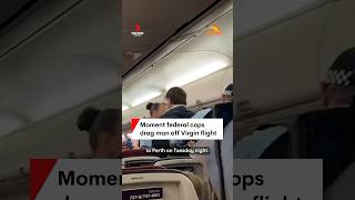 Moment federal cops drag man off Virgin flight