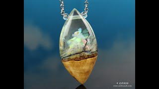 Wood and Resin Necklace Pendants with Aurora Opal interiors.