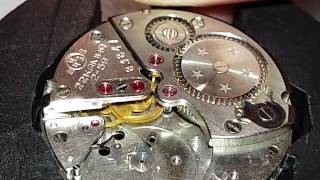 Watch gear train in motion without anchor and balance (vostok 2809) / wristwatch movement gears