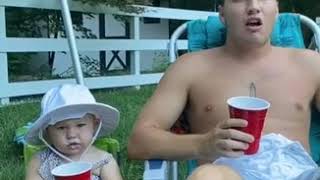 Toddler Imitates Uncle and Chugs her Drink - 1139861