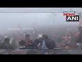 thousands of people gather on the ghats of sangam to take a holy dip in the triveni sangam