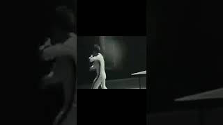 Bruce Lee playing table tennis using nunchucks
