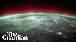 Nasa captures glowing aurora as it blankets Earth