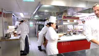 Busy Kitchen at 3 Michelin star Alain Ducasse au Plaza Athénée in Paris, France