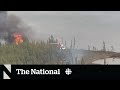 Crews battle flames near Yellowknife as evacuees face uncertainty