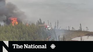 Crews battle flames near Yellowknife as evacuees face uncertainty