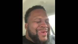 black man laughing in the car