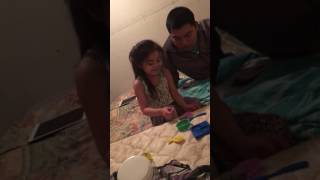 6 years old daughter feeding her dad