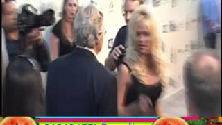 JERRY SPRINGER kisses PAM ANDERSON on red carpet run-in