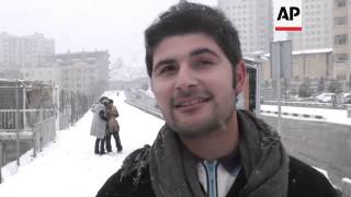 Snowfall in Tehran delights the locals