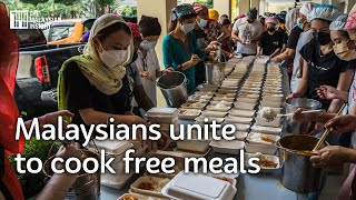 Malaysians unite to cook free meals for flood victims