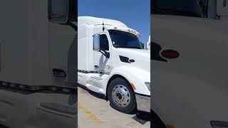 Beautiful white Peterbilt rig matching visor lights bumper small cut outs and tailored tank cover