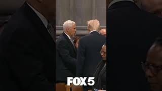 Mike Pence and Donald Trump shake hands at Jimmy Carter's funeral