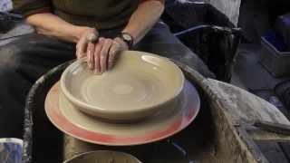 Making , Trimming & Decorating a large pottery plate on the wheel