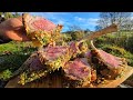 slow roasted rack of lamb cooked on hot stones outdoors asmr cooking in nature