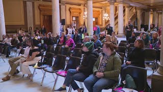 Reproductive health and access advocates rally at the Indiana Statehouse