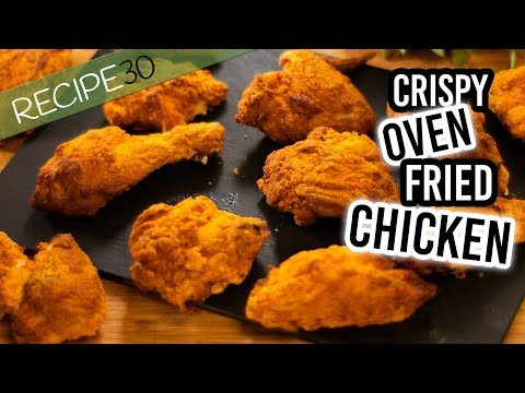 How can a crisp golden crust be promoted on Oven Fried Chicken?