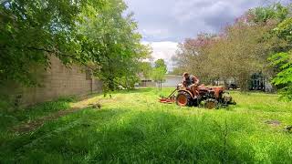 Kubota b7100 bushhogging lot in north lake charles