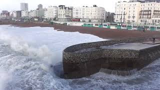 very stormy waves on a very high tide in brighton uk