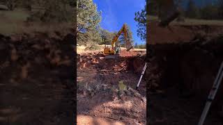 CAT 313 Hogging Dirt for New Driveway Cut In