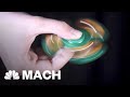 How Fidget Spinners Seem To Spin Forever | Mach | NBC News