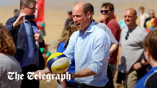 Prince William plays volleyball during Cornish beach visit