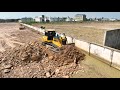 Bulldozer SHANTUI Push Stone With Truck Many Transport Stone Filling Land