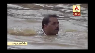 Ex BJP Mla Hira Solanki jump into Flooded River For Search Maldhari Man In Amreli