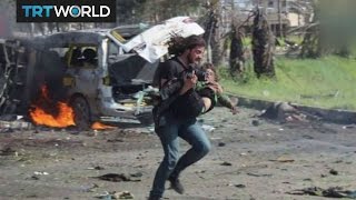 The War in Syria: Syrian photographer rescues blast victim