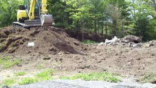 Yanmar ViO55 driving off the fill pile