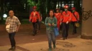 Protester escorted from HK university in wheelchair