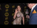 Luna Starr wears dress with a body print at the Xbiz Awards Red Carpet in Hollywood, CA