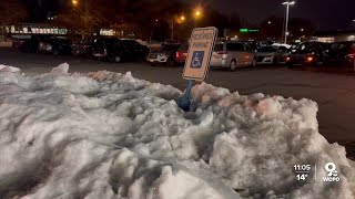 Mounds of snow block handicapped parking spots at Cincinnati shopping center