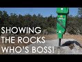 Removing rocks with hydraulic breaker