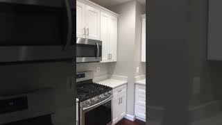 Sparkling white quartz countertop with white shaker cabinets