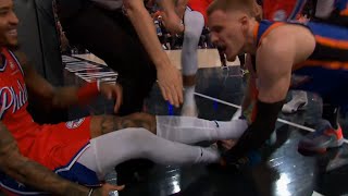 Kelly Oubre Jr can't stop laughing while Donte DiVincenzo trips him and starts f