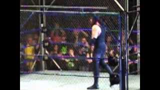 Undertaker defeating The Big Show via Hells Gate at a WWE Smackdown House Show Cage Match