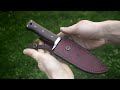 knife making forging a full tang hunting knife with a peened guard.