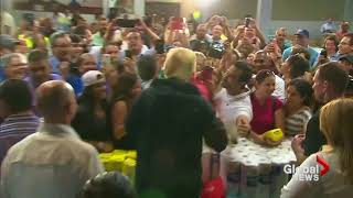 Donald Trump throws paper towels into crowd at Puerto Rico relief center