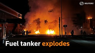 Fuel tanker explodes after crashing into a building