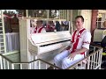 The Amazing Grayson playing piano at Casey's Corner in Magic Kingdom