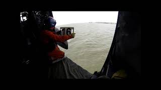 Belgian air force seaking MK48 performing a winching on a fishing vessel.