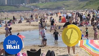 Britons flock to the beach as sweltering heatwave hits the UK