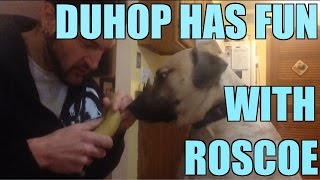 Duhop plays in the Snow with his dog Roscoe