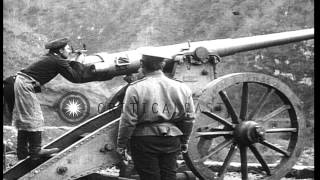 Russian soldiers fire artillery at Turkish position across a valley in the Caucas...HD Stock Footage