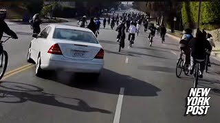 Wild videos show enraged driver nearly crashing into teen cyclists — who then go on the attack in LA