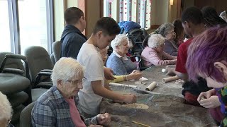 Students, Seniors Share Time Together Doing Art Project