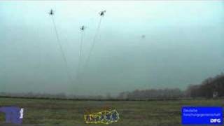 Load transportation using multiple UAVs