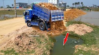 Wonderful Dump trucks unloading stone filling Land and skiller Technique operator Bulldozer Working.