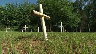 Unmarked graves reawaken old mystery